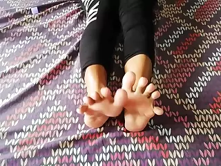 Indian MILF rubbing her beautiful feet with oil